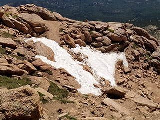 11 steps of snow left on the Pikes Peak Barr Trail on 7/2/2025